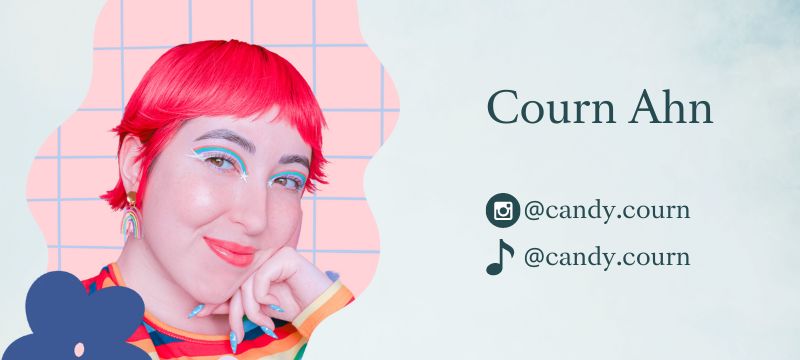Courn has vibrant pink hair and colourful makeup and smiles at the camera with text on the right